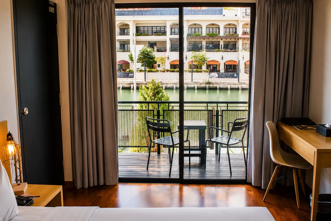 Premium river view room at Quayside Hotel Melaka with a balcony overlooking the Melaka River